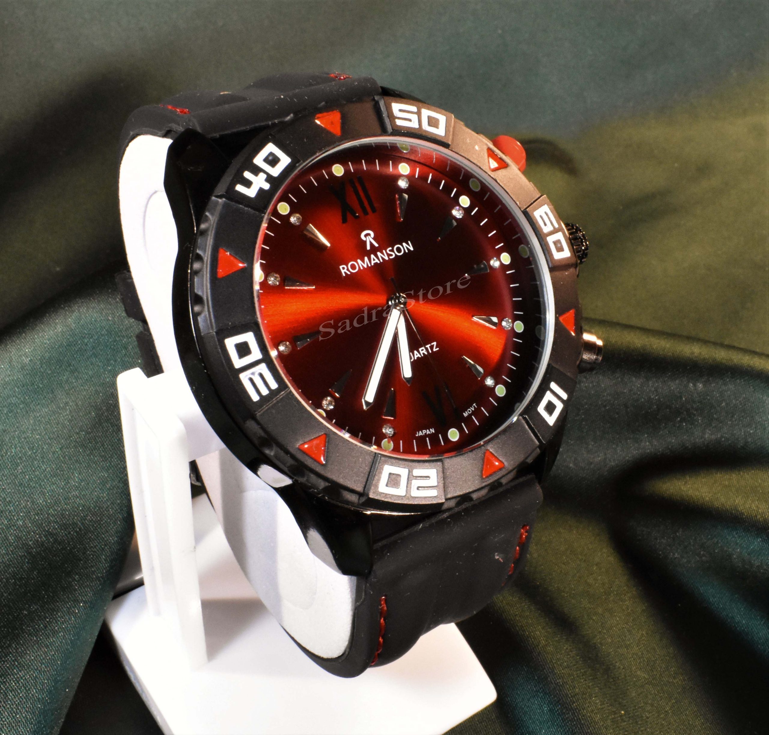 ROMANSON WATCH رومانسون تک موتوره نگین دار با صفحه زرشکی براق ** شیشه شفاف بندژله ای دور دوخت با صفحه ای ساده - Image 2